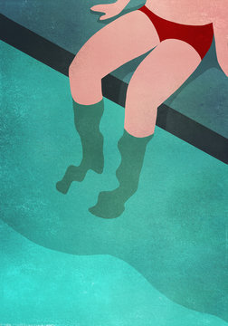 Low section of person relaxing at swimming pool