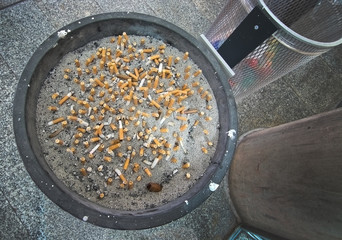 Ashtray full with cigarette stubs