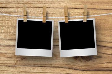 Blank photo frame with clothespin hanging.