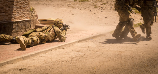 Fototapeta premium Soldiers in action in conflict zone III