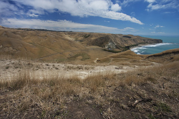 Sandy road winding down the hill.
