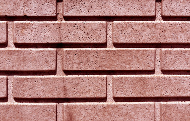 Red stylized brick wall texture.