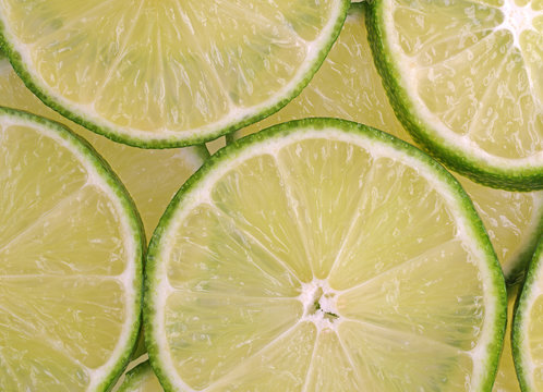 Lime slices close view illuminated with natural light.