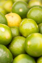 Fresh ripe limes as background