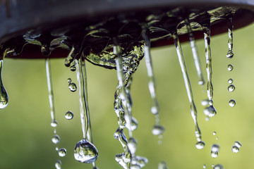 hoisting, close-up, nostalgia, window, cothes, sky

Raindrops on a rope for clothes on a blurred background.