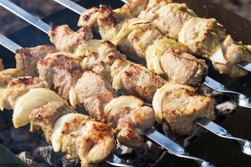 Barbecue skewers with grilled pork meat on the brazier