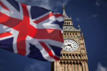 Plakat British union jack flag and Big Ben Clock Tower at city of westminster in the background - UK votes to leave the EU
