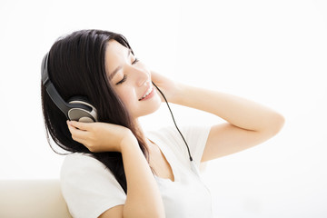 portrait of  young  woman in headphones listening to music