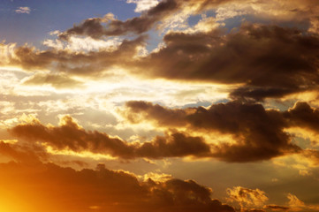 Multicolored clouds, illuminated by the setting sun
