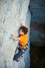 male rock climber. rock climber climbs on a rocky wall