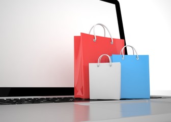 laptop and  shopping pags on white background. 3d rendering.