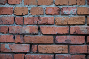 Red brick wall with cracked textured