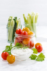 healthy snacks, mixed vegetables and yogurt on white background