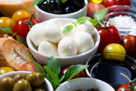 mozzarella, ingredients for the salad and bread, closeup
