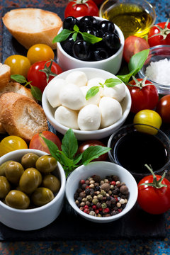 mozzarella, ingredients for the salad and bread, vertical