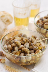 snails in blue bowl on white background