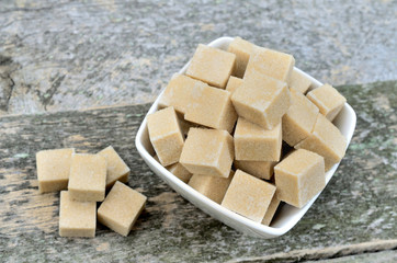 Sugar cubes in ceramic bowl