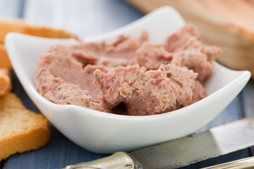 pork pate in bowl with toasts