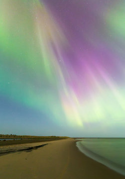 Aurora borealis over beach, Finalnd