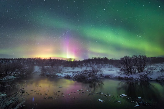 Aurora borealis over lake, Finland