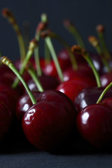 Cherries / Fresh cherries on a black wood background
