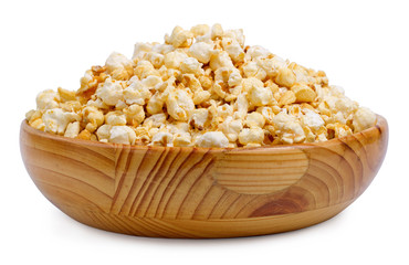 Popcorn in a wooden bowl on a white background