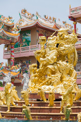 Golden statue of Naja god in Najasataisue Chinese Shrine located