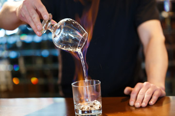 bartender burning Sambuca at the bar