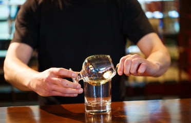 bartender burning Sambuca at the bar