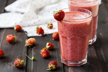 two glass of cold strawberry milk shake