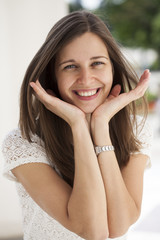 Fototapeta premium Closeup portrait of a happy young woman smiling