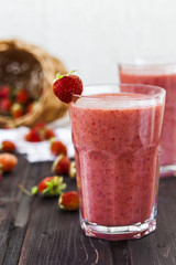 two glass of cold strawberry milk shake