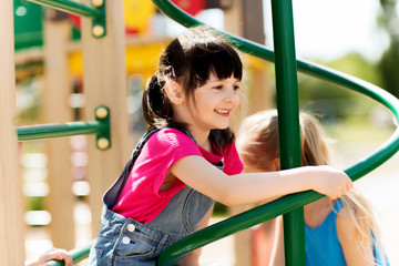 group of happy little girls on children playground