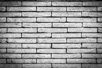 Closeup black and white brick wall texture for background. Grunge retro vintage of brick wall. Part of old brick wall for design with copy space for text or image. Dark edged.