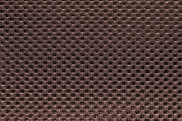Red brown fishnet cloth material texture background. Closeup nylon texture from nylon fabric for background and design with copy space for text or image.