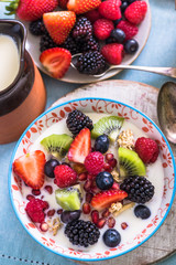 berries,kiwi, pommegranate seed in bowl