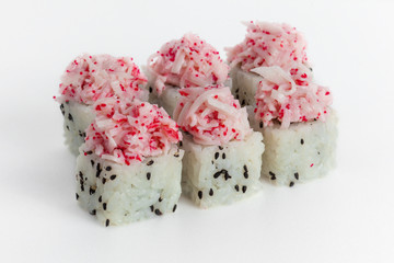 Sushi roll of rice with black sesame and caviar crab on a white background