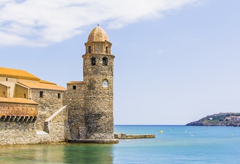 Fototapeta na wymiar Clock Tower in the old fortress on the sea