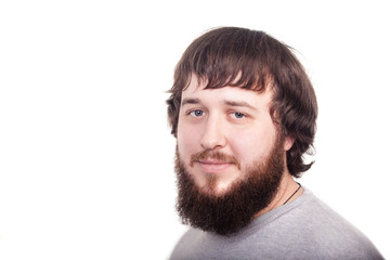 Obraz premium Bearded man confidently looking forward. Studio shot on white background