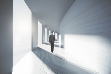 Man walking down corridor