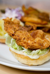 Organic free range golden fried chicken breast fillet, served on a bed of lettuce, mayo and a white bread bun.