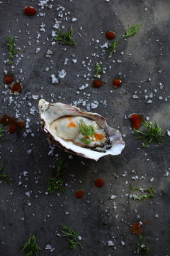Oyster with tabasco chili sauce and salt