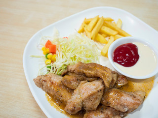 Pork Steak with salad and french fries.