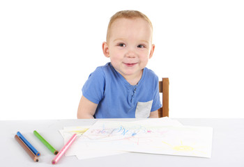 Little boy is drawing the picture