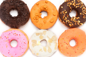Delicious donuts with icing isolated on white