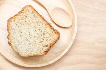 Sweet cake in wooden plate