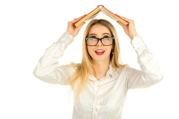 girl in glasses holding a book above the head