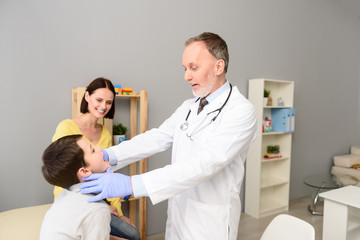 Pediatrician doctor examining child