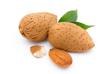Almonds with leaves isolated on white background