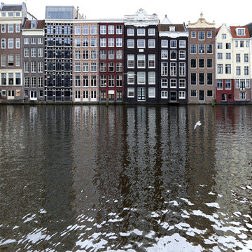 Houses in a row along canal, Amsterdam, Holland